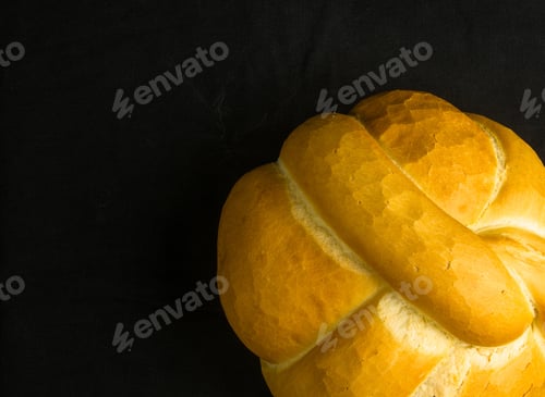 Preview: Fresh Braided Loaf Of White Wheat Bread On Black Background
