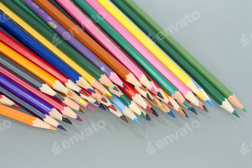 Preview: Group Of Sharp Colored Pencils With White Background And Reflexions