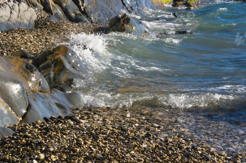 Preview: Rocky Sea Shore With Pebble Beach, Transparent Waves With Foam, On A Warm Summer Day