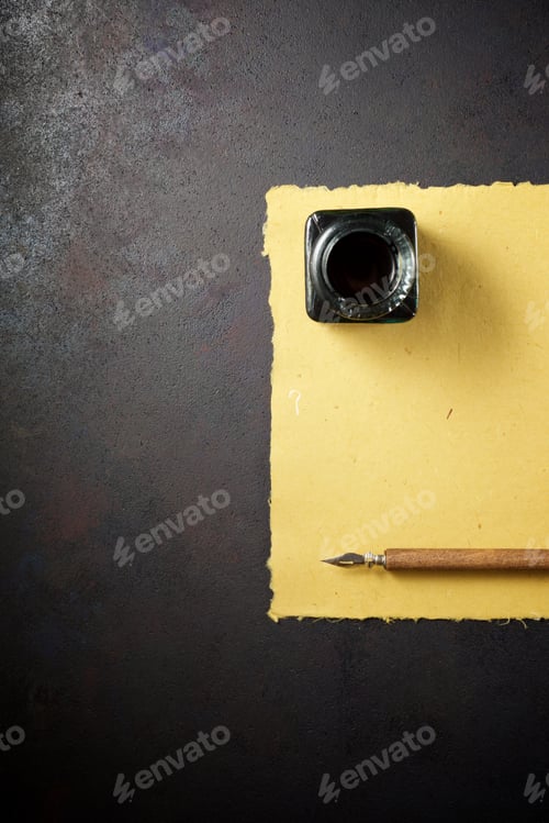 Preview: Nib Pen For Calligraphy And Inkwell On A Table.