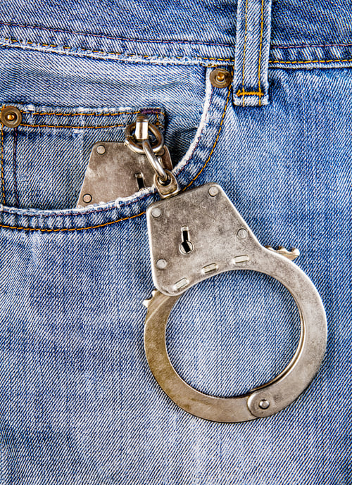 Preview: Handcuffs In The Pocket Of The Jeans Closeup