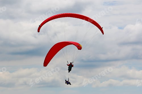 Preview: Paragliders Flying In A Cloudy Sky