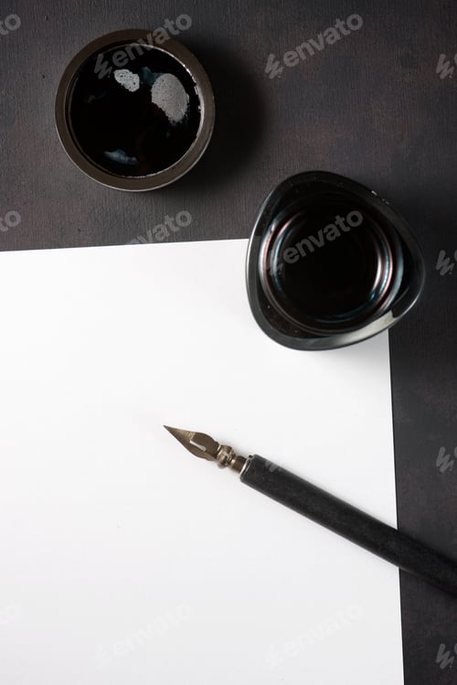 Preview: Nib Pen For Calligraphy And Inkwell On A Table.