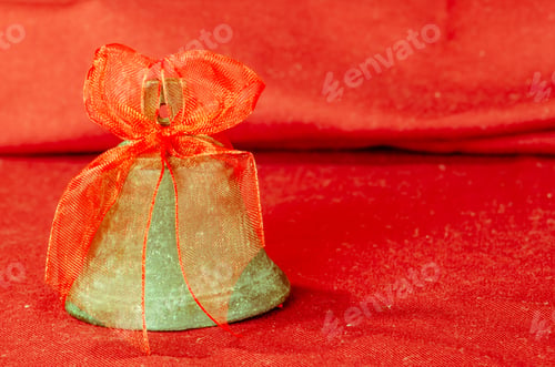 Preview: Detail Of Golden Bell On Red Background