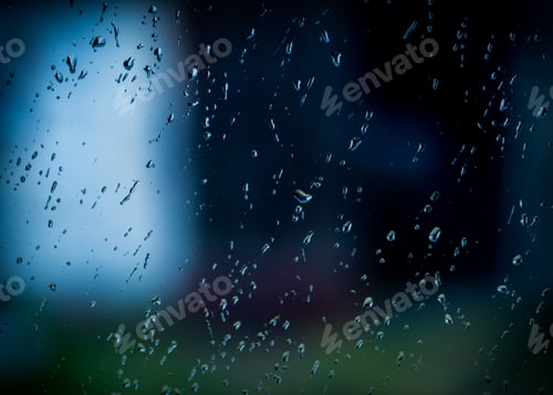 Preview: Water Droplets On Window At Dark Autumnal Rainy Day. Water On Glass Background.