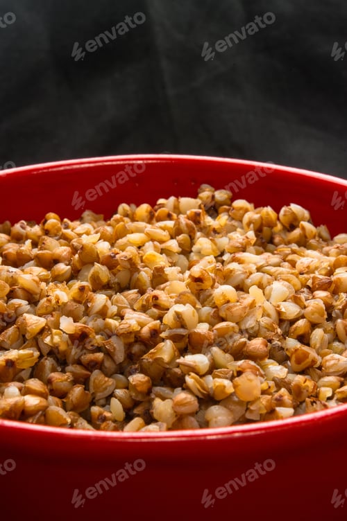 Preview: Diet Food - Hot Buckwheat Cereal In A Red Bowl On A Black Background