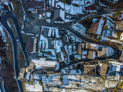 Preview: Arial View Of Village In Swiss Mountains In Ticino In Winter With Snow Covered Roofs