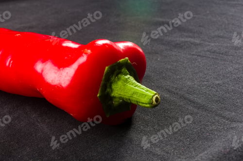 Preview: Fresh Organic Red Chili Peppers On A Black Background, Close-Up