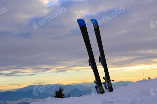 Preview: Mountain Ski In Snow On Evening Sky Background