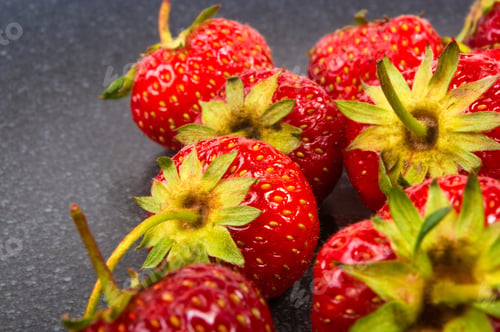 Preview: Fresh Ripe Berries Strawberries On Black Ceramic Plate On White Background