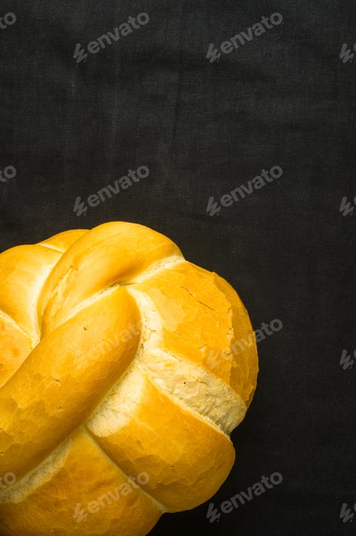 Preview: Fresh Braided Loaf Of White Wheat Bread On Black Background