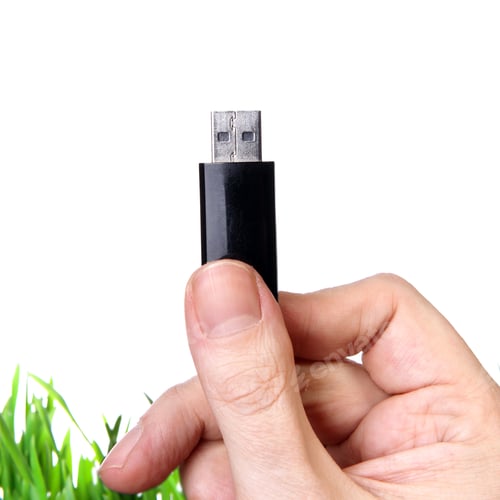 Preview: Usb Drive In A Hand On The White Background Closeup