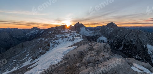 Preview: Male Hikers At The Top Of The Mountain At Sunset.