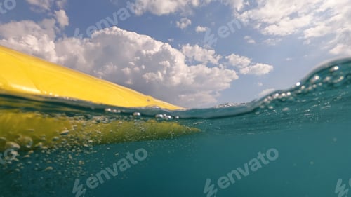 Preview: Underwater And Above Photo Of Yellow Surfboard In Tropical Exotic Bay With Turquoise Sea And