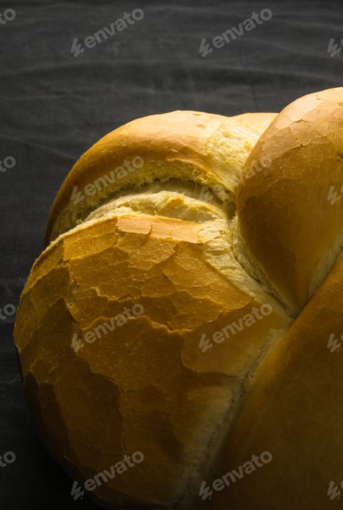 Preview: Fresh Braided Loaf Of White Wheat Bread On Black Background