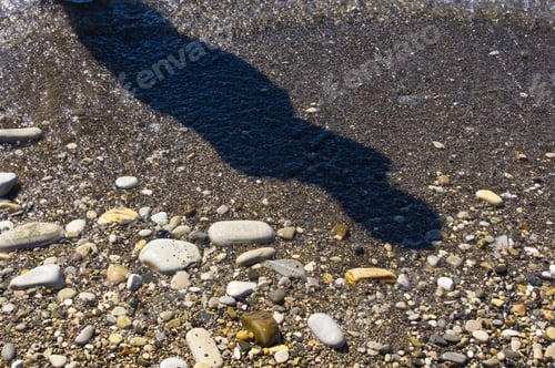 Preview: Sea Pebble Beach With Multicoloured Stones, Transparent Waves With Foam, On A Warm Summer Day With