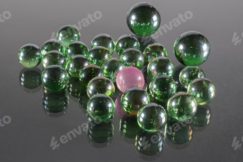 Preview: Small Emerald Green Glass Balls With Reflection And One Pink Ball.