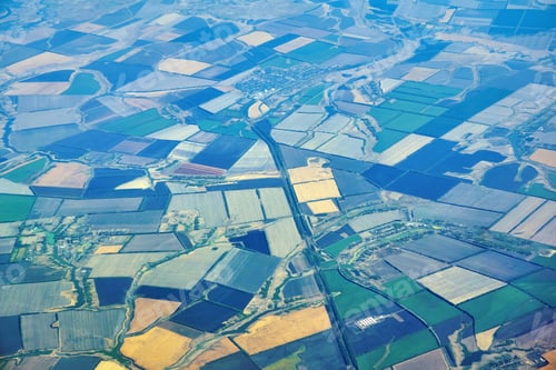 Preview: Aerial View Of A Densely Populated Region With Multi-Colored Fields And Settlements