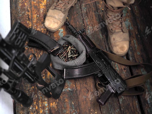 Preview: Close Up Photo Of A Soldier Boots And Handgun. War.