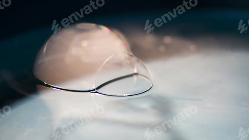 Preview: Abstract Shot With Big Soap Bubbles On A Water Surface With Smoke Inside. Image Has Grain Texture