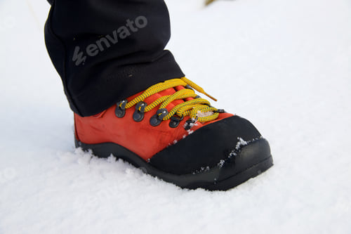Preview: Closeup Of Hiking Boots In The Snow.