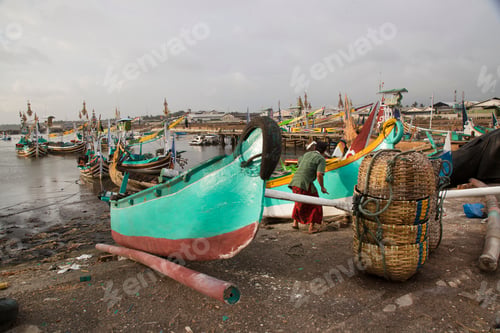 Preview: Brightly Colored And Traditional Fishing Boats Moored In An Indonesian Port, Sailors And Workmen