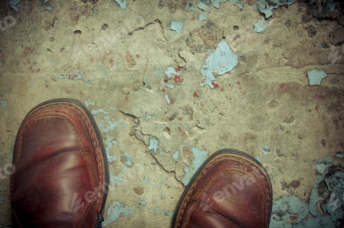 Preview: Vintage Worn-Out Boots On Concrete Floor, Closeup