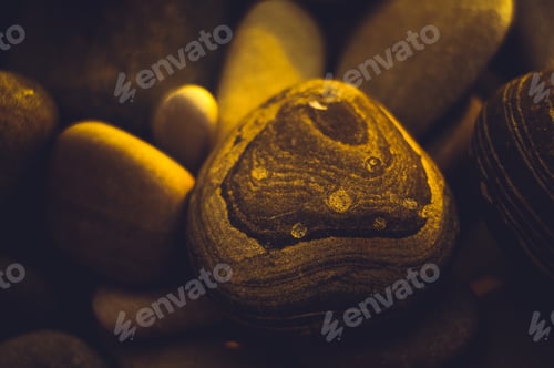 Preview: Boulders And Colorful Pebbles On The Beach