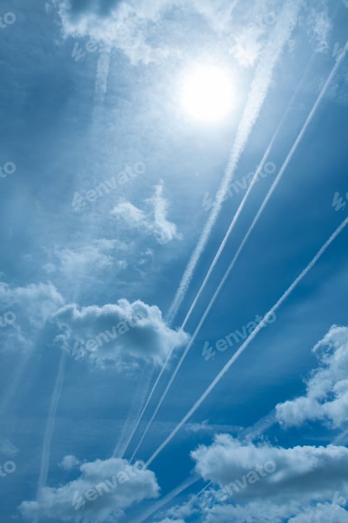 Preview: Contrails in a Blue Sky with Clouds