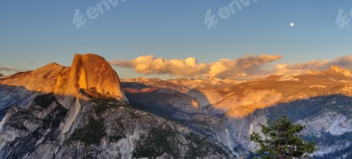 Preview: A Panoramic View Of Half Dome And Yosemite Valley. Golden Light From The Sunset Is Cast Upon The