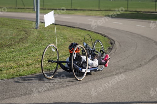 Preview: Athlete Girl With Helmet Riding Her Hand Cycle On A Track.