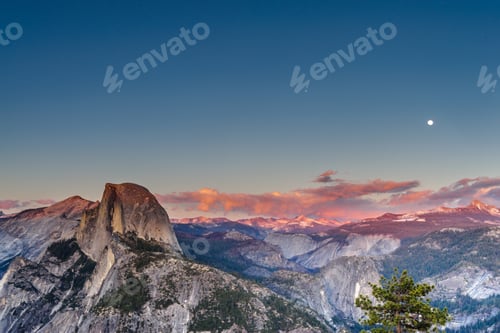 Preview: A Panoramic View Of Half Dome And Yosemite Valley. Golden Light From The Sunset Is Cast Upon The