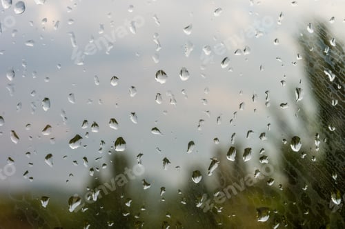 Preview: Raindrops On Window Glass On Background Of Cloudy Sky