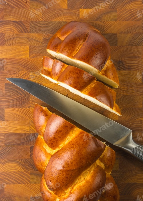 Preview: Chunks Large Braided Loaf With Knife On Wooden Background
