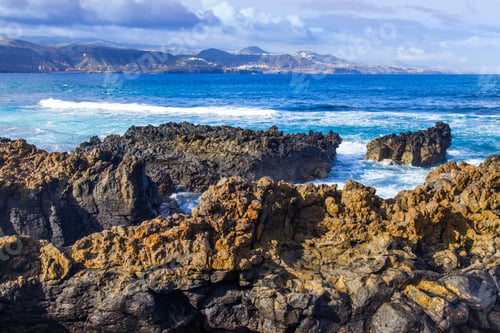 Preview: The Picturesque Rock At The Coast Of The Atlantic Ocean Is Washed By Waves