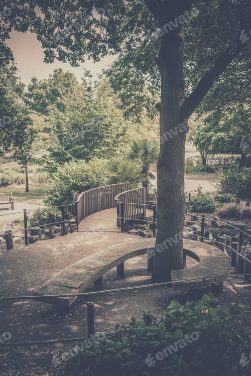 Preview: Twisted Bench Around A Tree In A Public Park In Wimbledon, London