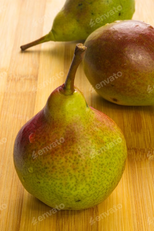 Preview: Ripe Colorful Pears On A Wooden Background