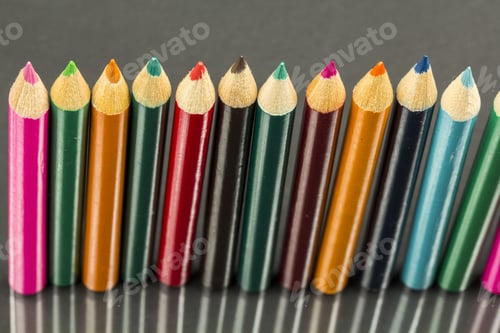 Preview: Group Of Sharp Colored Pencils With Reflexions On Dark Background
