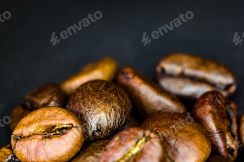 Preview: Brown Roasted Coffee Beans On Black Background, Close Up, Macro