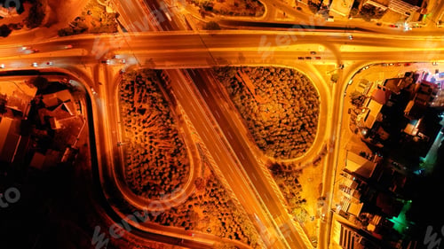 Preview: Aerial Drone Slow Shutter Night Shot Of Urban Elevated Toll Road Junction And Interchange Overpass