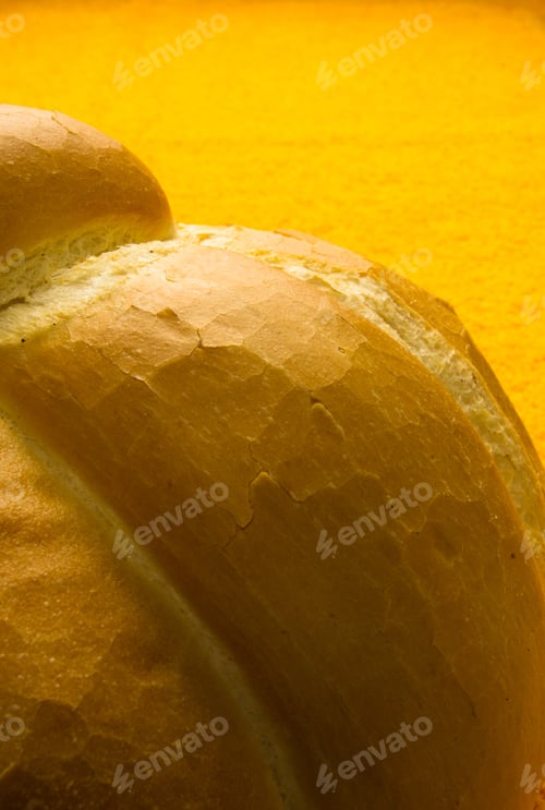 Preview: Fresh Braided Loaf Of White Wheat Bread On An Yellow Napkin