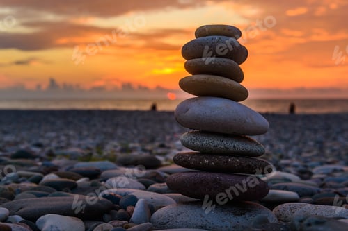 Preview: Stones Pyramid On Sand Symbolizing Zen, Harmony, Balance. Black Sea At Sunset In The Background.