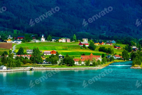 Preview: Norwegian Village Landscape With Fjord, Mountains And Colorful Houses, Church In Olden, Norway