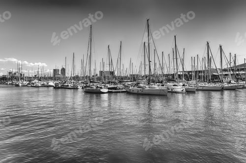 Preview: Sailboats And Ships Docked In The Scenic Port Vell, One Of The Main Tourist Destinations In