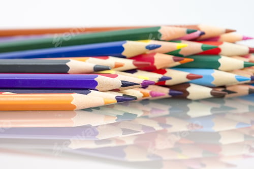 Preview: Group Of Sharp Colored Pencils With White Background And Reflexions