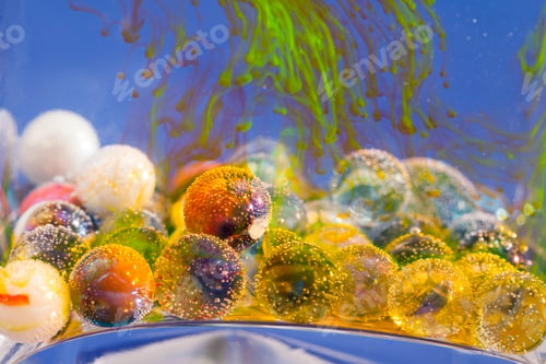 Preview: Ink Shapes In A Glass Vase Over Glass Balls With Bubbles