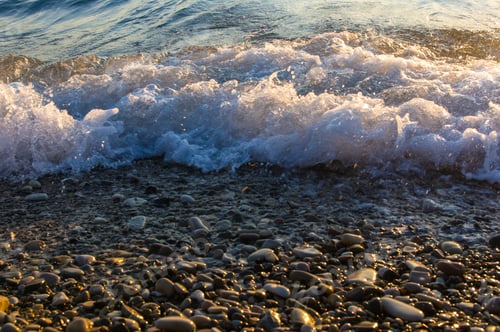 Preview: Sea Pebble Beach With Multicoloured Stones, Transparent Waves With Foam, On A Warm Evening