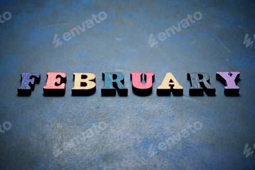 Preview: February Word On A Blue Table.