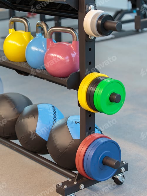 Preview: Colorful Kettlebells And Medicine Balls For Fitness.