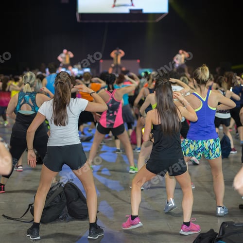 Preview: Fitness Workout In Gym: People Doing Exercises In Class With Music And Teacher On Stage.